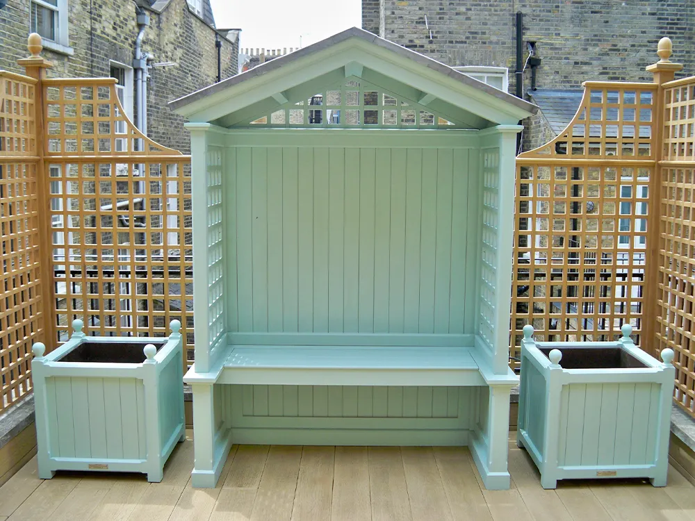 painted wooden arbour with matching planters